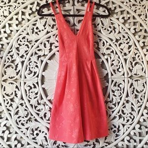 Coral dress with embossed floral print